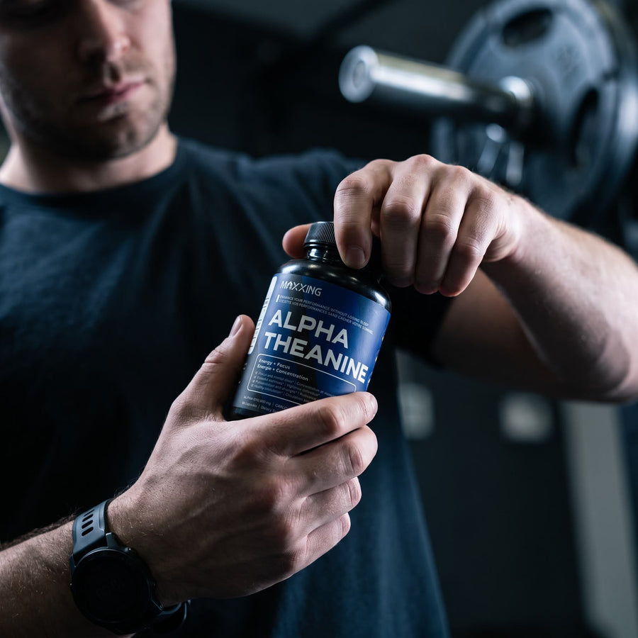 Man opening Alpha Theanine at the gym